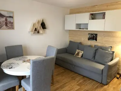 Coin salon dans l'établissement Le chalet de 