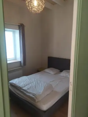 Un ou plusieurs lits dans un hébergement de l'établissement Location à Argentat-sur-Dordogne
