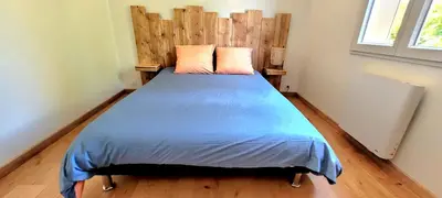 Un ou plusieurs lits dans un hébergement de l'établissement MAISON PLEIN-PIED DÉTENTE ASSUREE Clim-BBQ