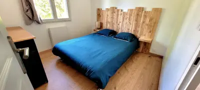 Un ou plusieurs lits dans un hébergement de l'établissement MAISON PLEIN-PIED DÉTENTE ASSUREE Clim-BBQ