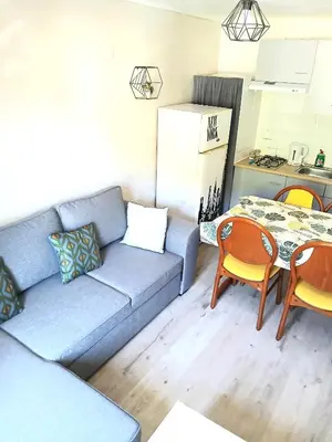 Coin salon dans l'établissement L'Hermitage - Piscine et Bien-être
