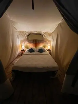 Un ou plusieurs lits dans un hébergement de l'établissement Domaine des Etangs de Taysse