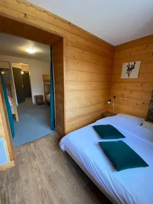 Un ou plusieurs lits dans un hébergement de l'établissement LE BUFADOU - Gîte Auberge -