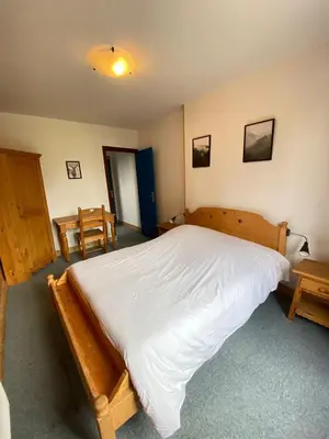 Un ou plusieurs lits dans un hébergement de l'établissement LE BUFADOU - Gîte Auberge -