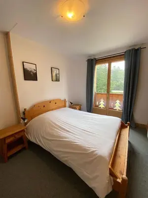 Un ou plusieurs lits dans un hébergement de l'établissement LE BUFADOU - Gîte Auberge -
