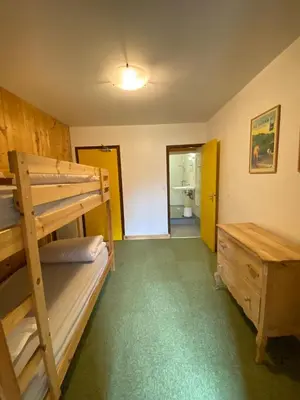 Un ou plusieurs lits dans un hébergement de l'établissement LE BUFADOU - Gîte Auberge -