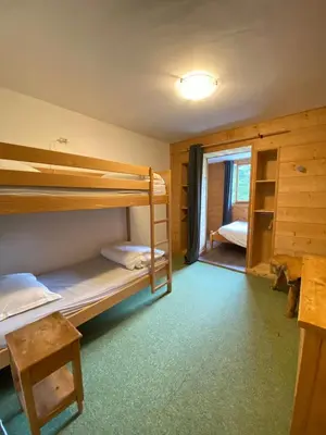 Un ou plusieurs lits dans un hébergement de l'établissement LE BUFADOU - Gîte Auberge -