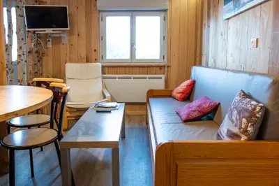 Coin salon dans l'établissement Les Genêts du Sancy