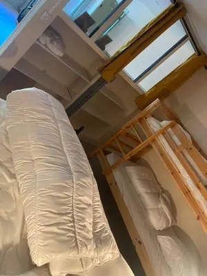 Un ou plusieurs lits dans un hébergement de l'établissement Appartement en Rez de jardin
