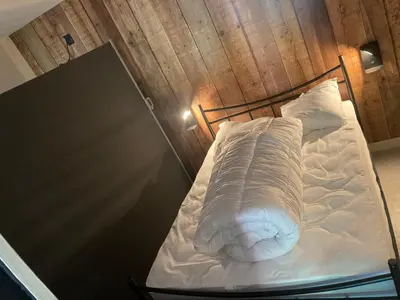 Un ou plusieurs lits dans un hébergement de l'établissement Appartement en Rez de jardin