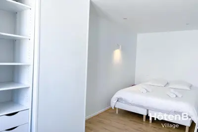 Un ou plusieurs lits dans un hébergement de l'établissement T3 Duplex charme de l'ancien - coeur de ville
