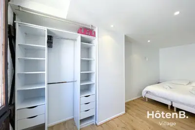 Un ou plusieurs lits dans un hébergement de l'établissement T3 Duplex charme de l'ancien - coeur de ville