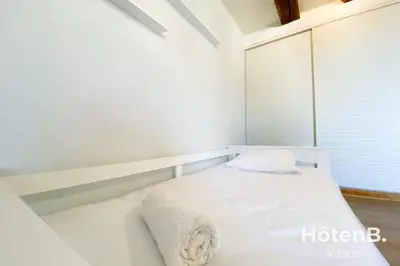 Un ou plusieurs lits dans un hébergement de l'établissement T3 Duplex charme de l'ancien - coeur de ville