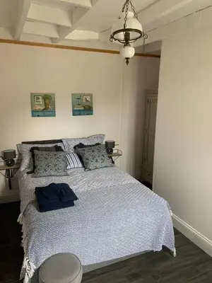 Un ou plusieurs lits dans un hébergement de l'établissement Maison Les Berrys