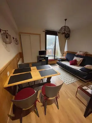 Coin salon dans l'établissement Appartements bien situés avec terrasse