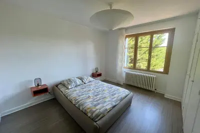 Un ou plusieurs lits dans un hébergement de l'établissement Villa La Baronnie - 11 pers - Proche Brive -Jardin
