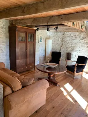 Coin salon dans l'établissement Petite maison Conjat