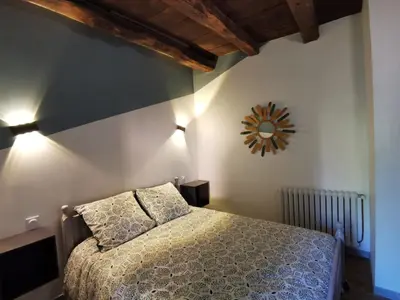 Un ou plusieurs lits dans un hébergement de l'établissement Maison typique périgourdine avec piscine