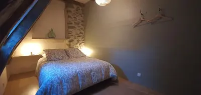 Un ou plusieurs lits dans un hébergement de l'établissement Maison typique des monts du Cantal