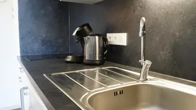 Cuisine ou kitchenette dans l'établissement Apparts Confort 87