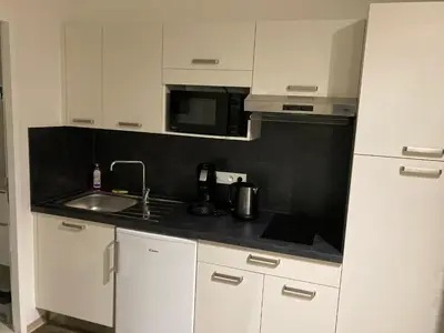 Cuisine ou kitchenette dans l'établissement Apparts Confort 87