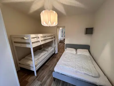 Un ou plusieurs lits dans un hébergement de l'établissement Appartement 4 personnes, wifi, proche centre et thermes
