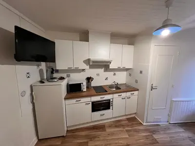 Cuisine ou kitchenette dans l'établissement Appartement 4 personnes, wifi, proche centre et thermes