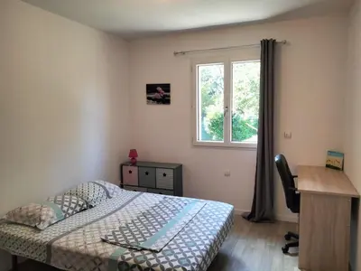 Un ou plusieurs lits dans un hébergement de l'établissement Maison du rieu 8 personnes