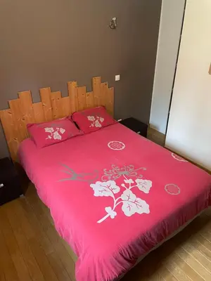 Un ou plusieurs lits dans un hébergement de l'établissement Maison du rieu 8 personnes