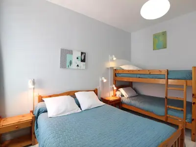 Un ou plusieurs lits dans un hébergement de l'établissement Appartement T3 proche centre La Bourboule avec terrasse - FR-1-608-236