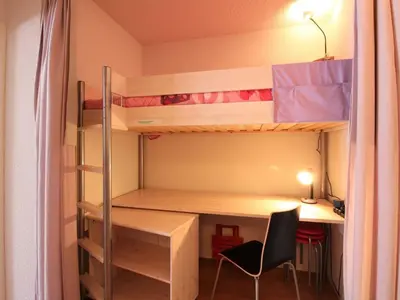 Un ou plusieurs lits dans un hébergement de l'établissement T3 avec terrasse, 2 parkings, au Mont-Dore - FR-1-608-235