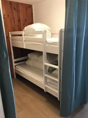 Un ou plusieurs lits dans un hébergement de l'établissement Appartement 4 pers Tour de la Biche skis aux pieds
