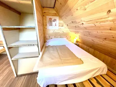 Un ou plusieurs lits dans un hébergement de l'établissement La cabane au pied des pistes
