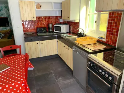 Cuisine ou kitchenette dans l'établissement La Residence rdc