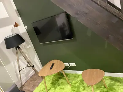Télévision ou salle de divertissement dans l'établissement La pause zen