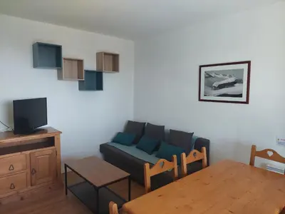 Télévision ou salle de divertissement dans l'établissement Super Besse 5/6 pers. Vue sur les monts du cantal