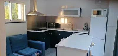 Cuisine ou kitchenette dans l'établissement GITE DOUSTRET