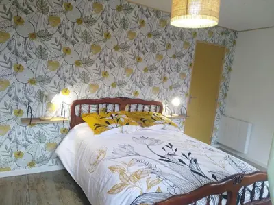 Un ou plusieurs lits dans un hébergement de l'établissement Appartement cozy maison Ed Den