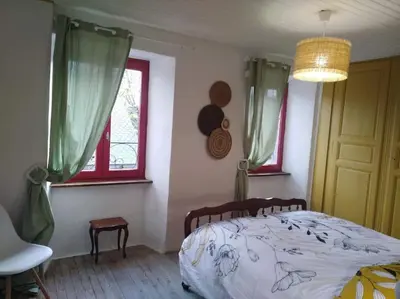 Un ou plusieurs lits dans un hébergement de l'établissement Appartement cozy maison Ed Den