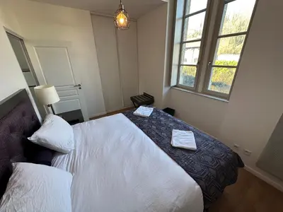 Un ou plusieurs lits dans un hébergement de l'établissement Cocon au calme sur vezere