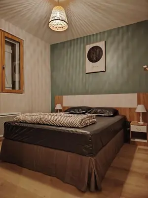 Un ou plusieurs lits dans un hébergement de l'établissement Gîtes des Deux Vallées La Borieta du Causse - Rocamadour