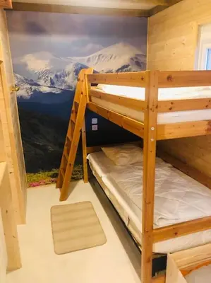 Un ou plusieurs lits superposés dans un hébergement de l'établissement Le 77 - chalet nature proche S.Besse