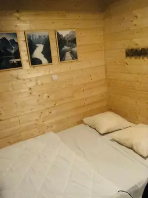 Un ou plusieurs lits dans un hébergement de l'établissement Le 77 - chalet nature proche S.Besse