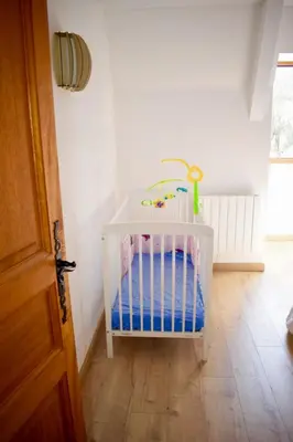 Un ou plusieurs lits dans un hébergement de l'établissement Suite Familiale 2 chambres double
