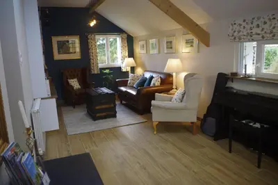 Coin salon dans l'établissement Chambres d'hôtes de La Vieille Ferme
