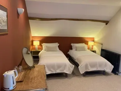 Un ou plusieurs lits dans un hébergement de l'établissement Chambres d'hôtes de La Vieille Ferme
