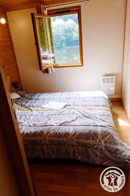 Un ou plusieurs lits dans un hébergement de l'établissement Gîte Chalet n°1
