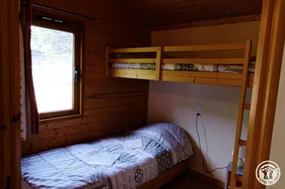 Un ou plusieurs lits dans un hébergement de l'établissement Gîte Chalet n°1