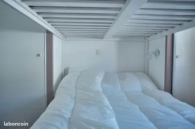 Un ou plusieurs lits dans un hébergement de l'établissement Appartement Hauteurs Super Besse - 4 personnes -Piscine & Garage