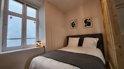 Un ou plusieurs lits dans un hébergement de l'établissement Les Appartements de Louis Spacieux-centre ville-mairie